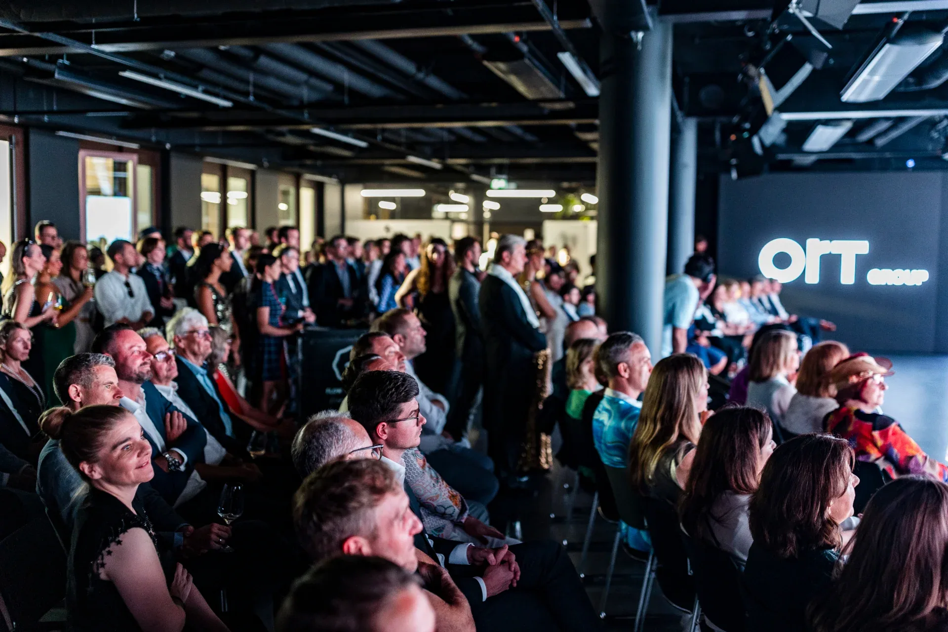 Conference audience in front of the LED stage at SPARK Junghof